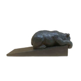 Decorative door stopper shaped like a bear on a white background