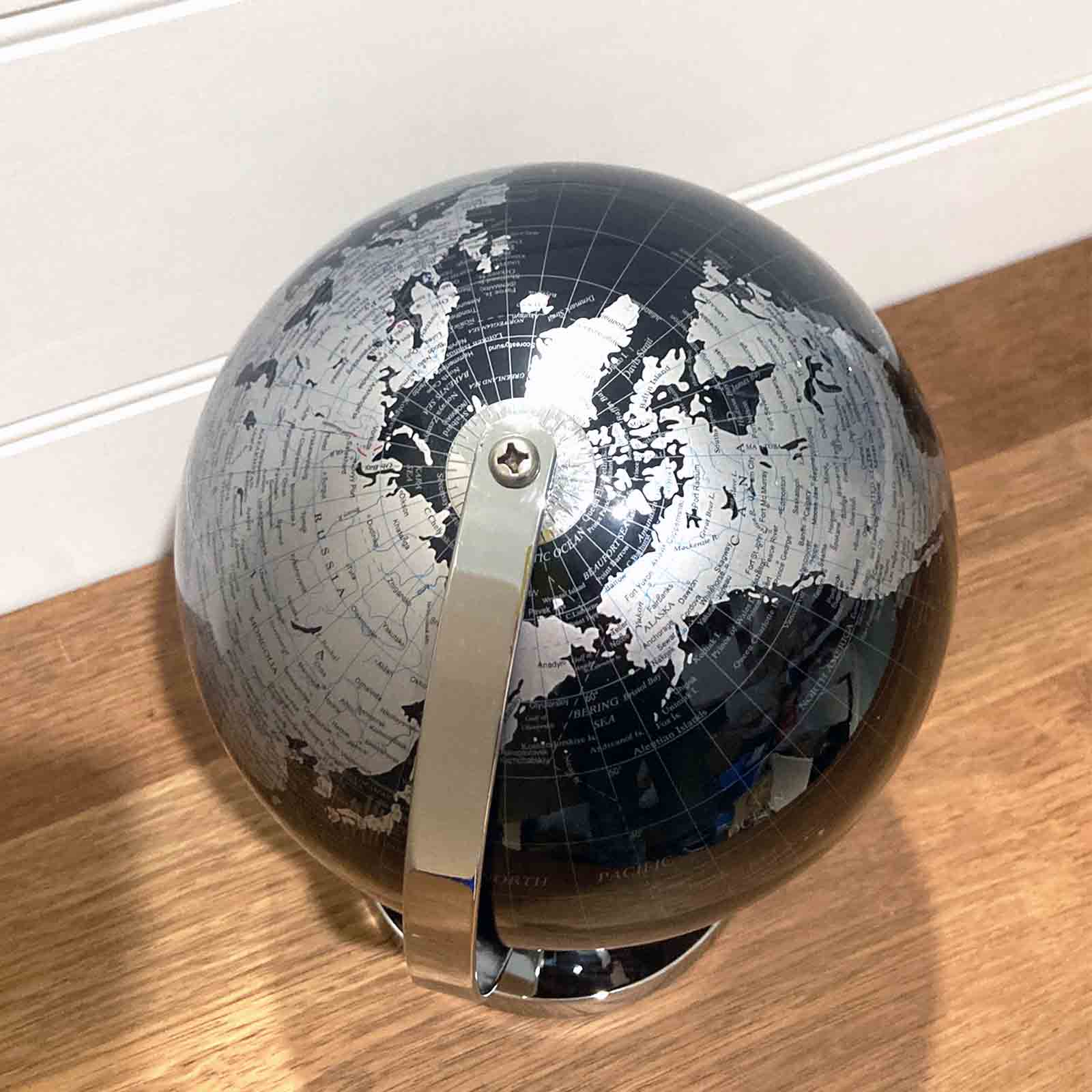 Black and Silver Desktop World Globe on Metal Stand