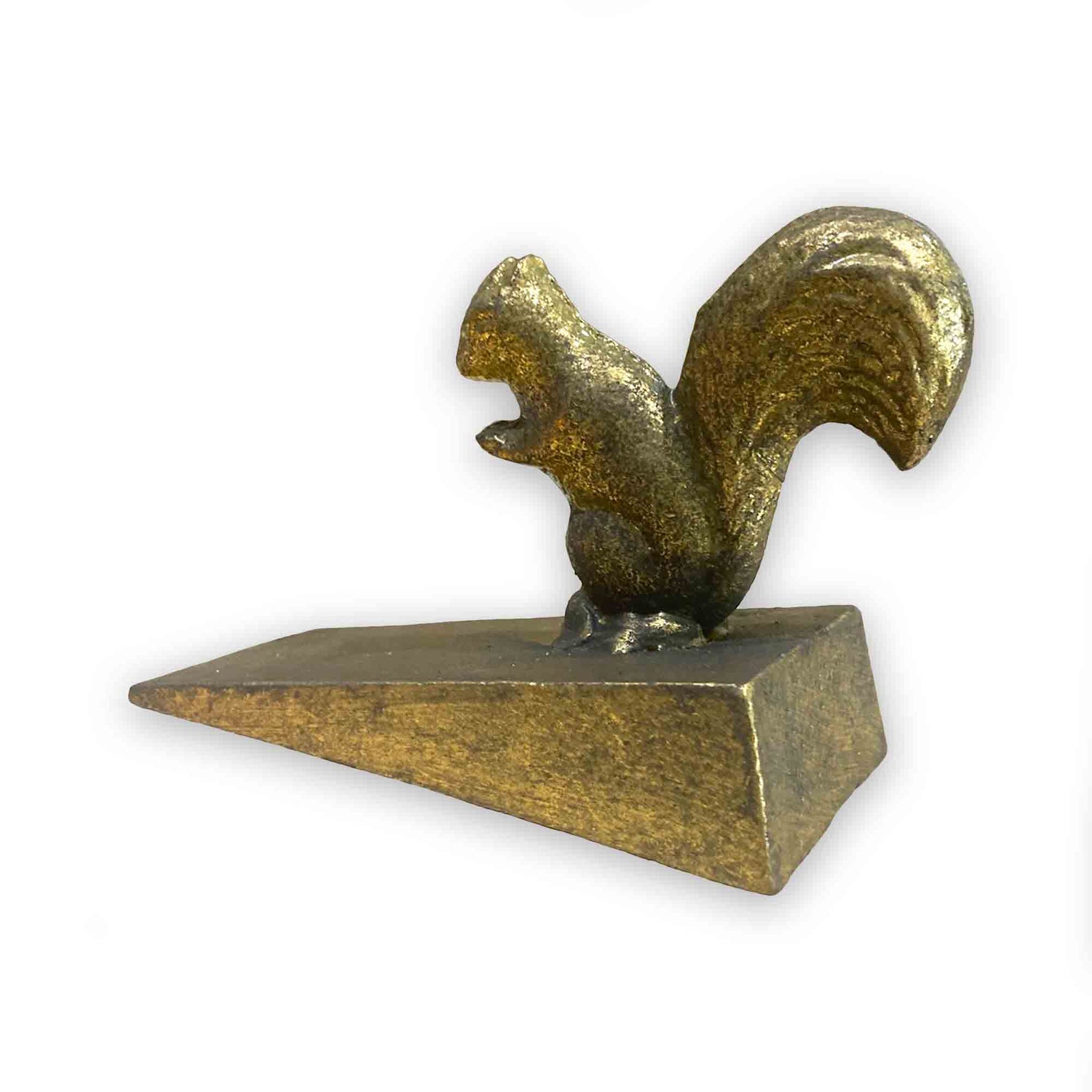 Gold coloured metal squirrel door stop wedge on a white background
