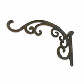 Decorative metal bracket with intricate scroll design on a white background