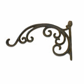 Decorative metal bracket with intricate designs on a white background