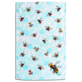 Tea towel with bee and flower pattern on a light blue background