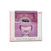 Pink baby egg cup with saucer and spoon set in packaging, featuring Marja Leena koala artwork.
