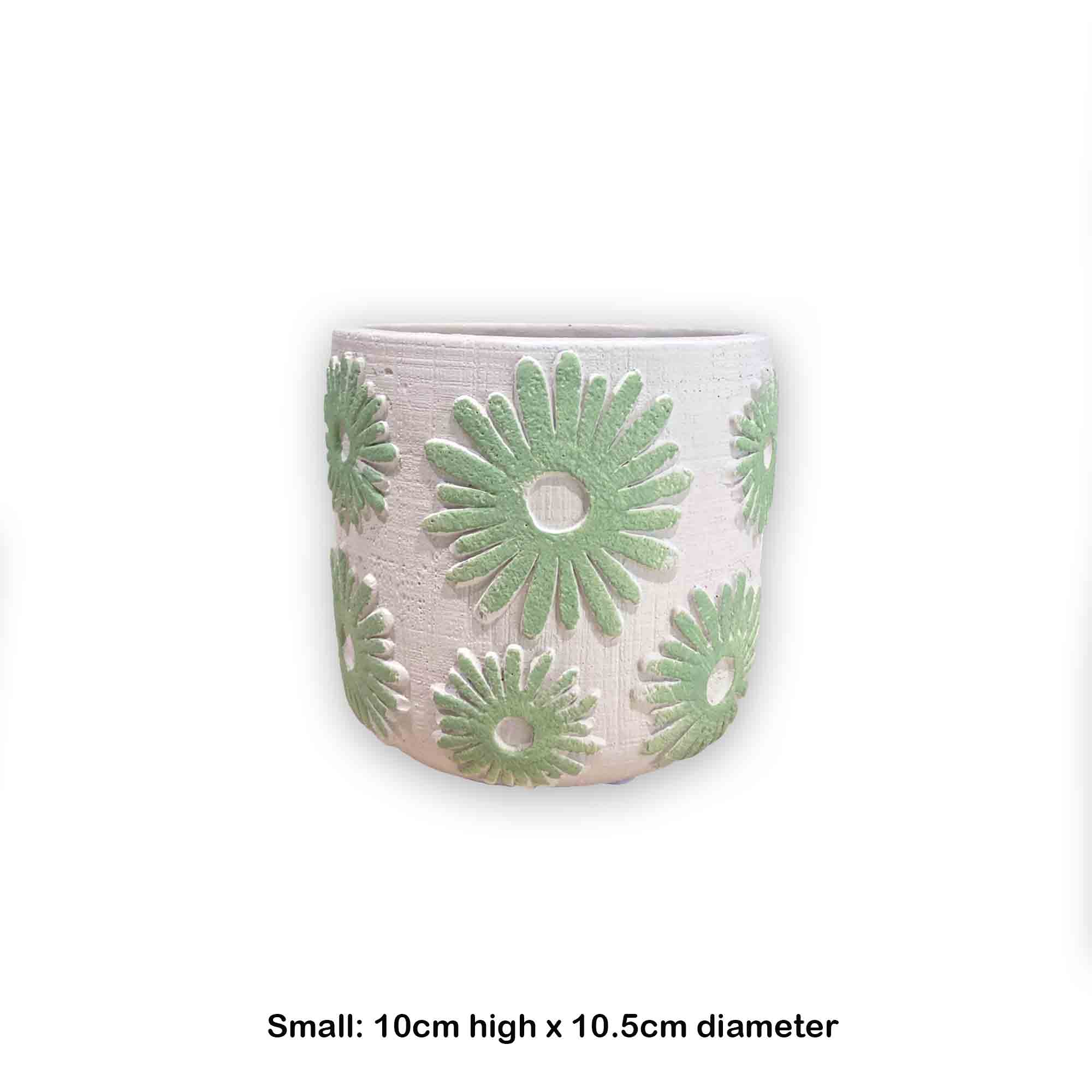 Concrete pot with green floral daisy pattern on a white background