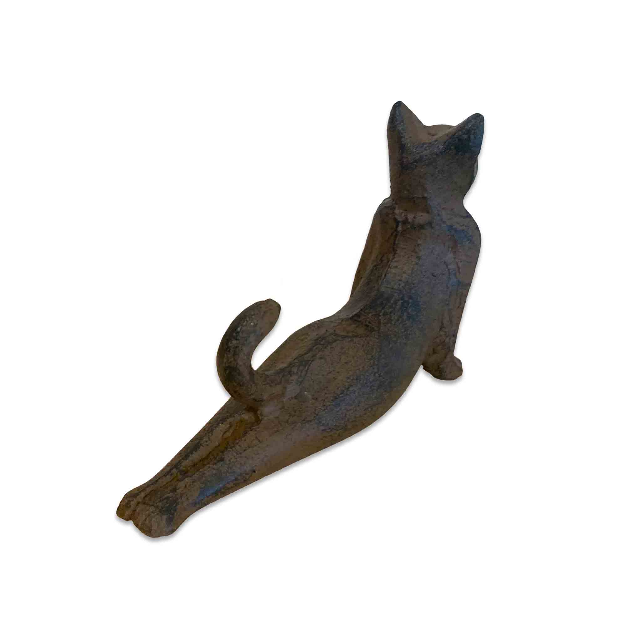 Cast iron cat-shaped door stopper on a white background