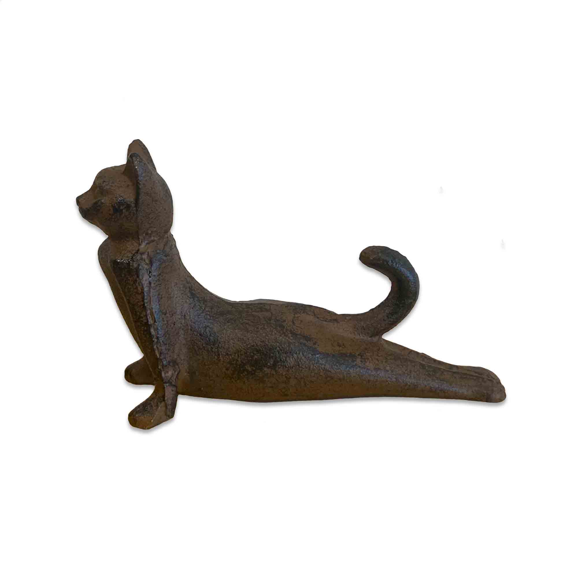 Cast iron cat-shaped door stopper on a white background