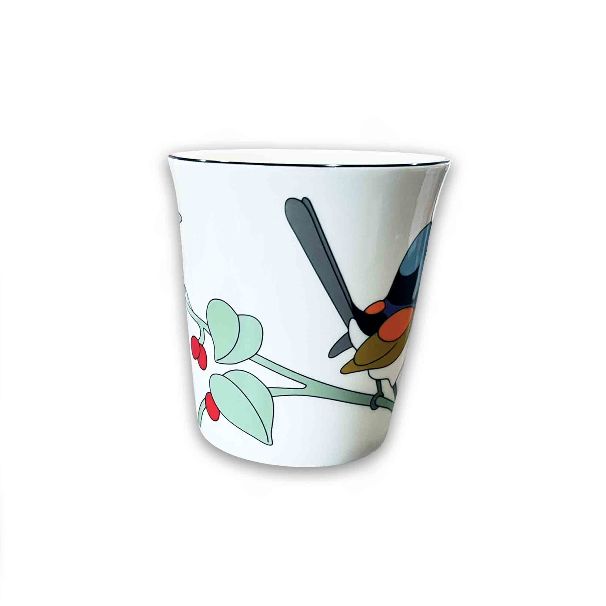 White mug with a colorful bird design on a white background