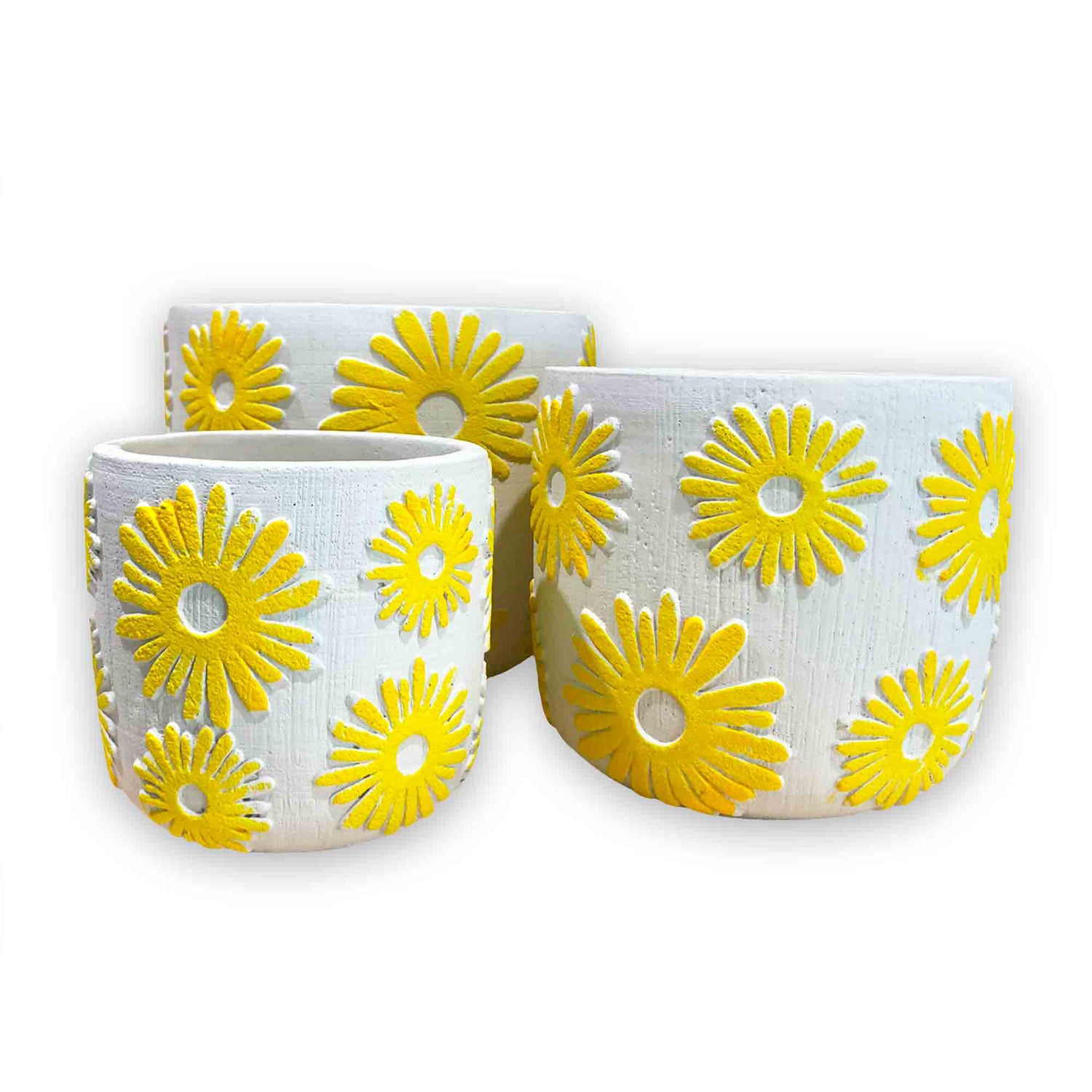 Three concrete planters with yellow daisy embossed floral design