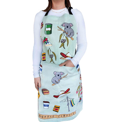 Aussie Classics cotton heavy drill apron featuring Australian-themed illustrations including koalas, coffee cups, gum leaves and sweet treats