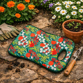 Floral-patterned Australian Botanical garden mat on a stone surface with gardening tools and plants.