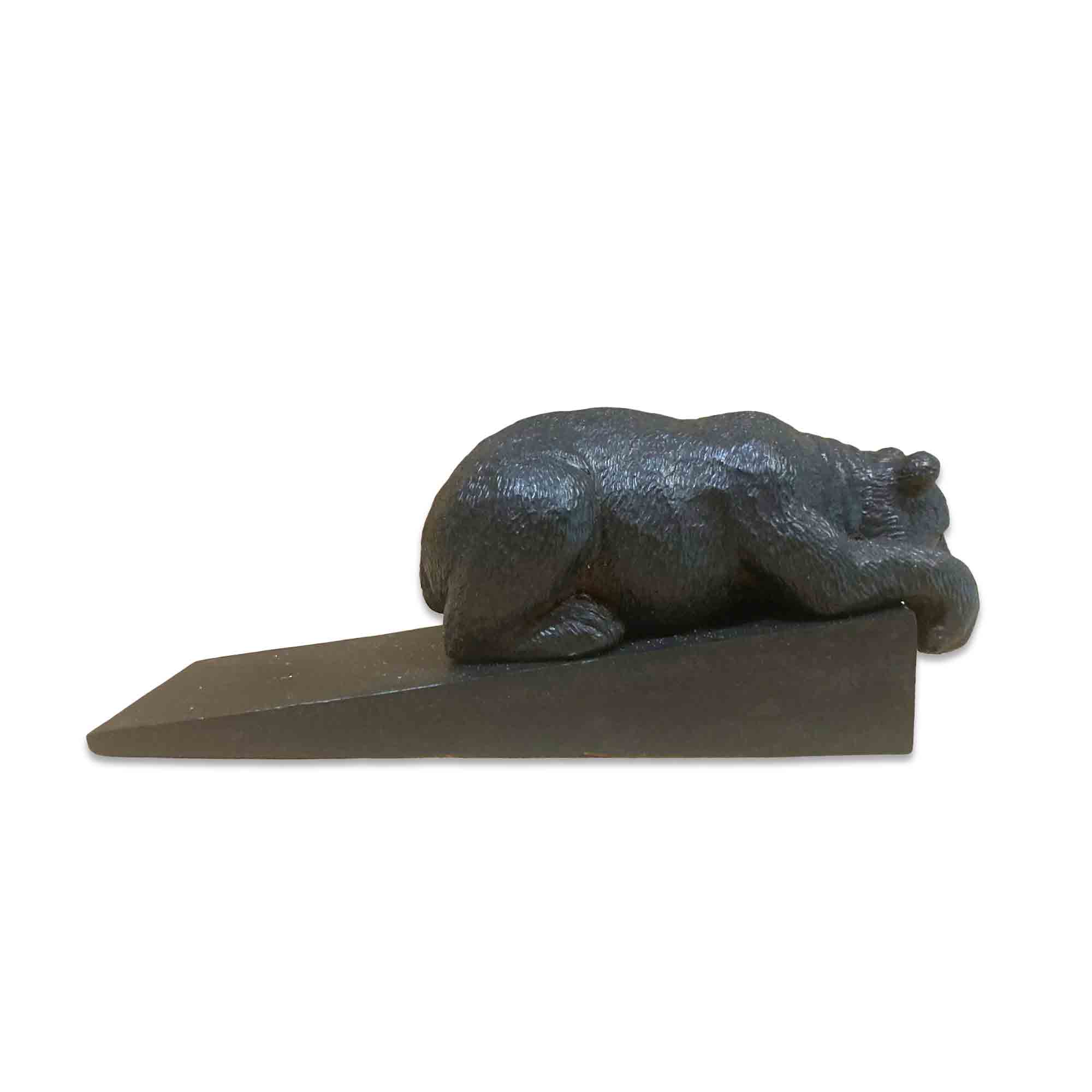 Decorative door stopper shaped like a bear on a white background