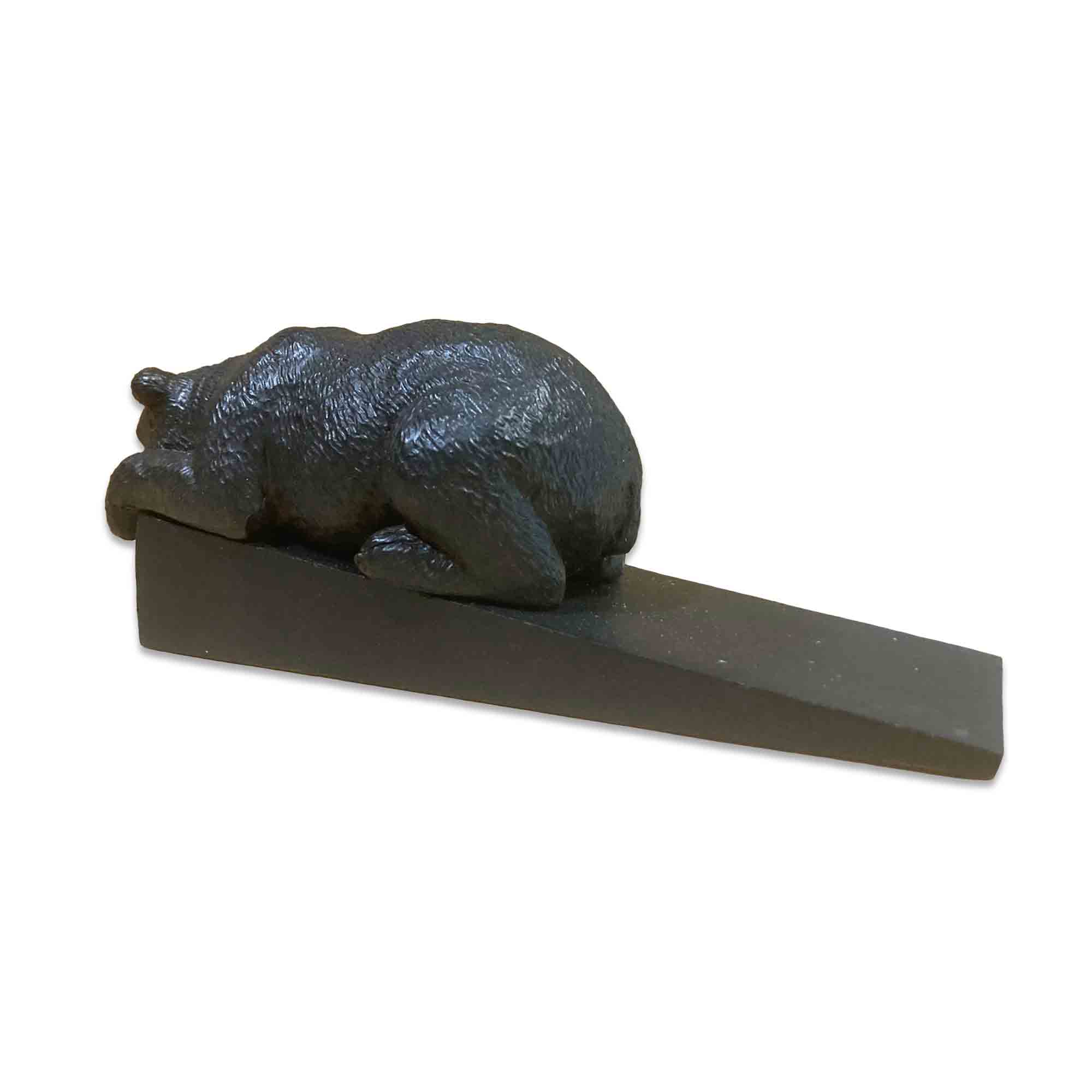Decorative door stopper shaped like a bear on a white background