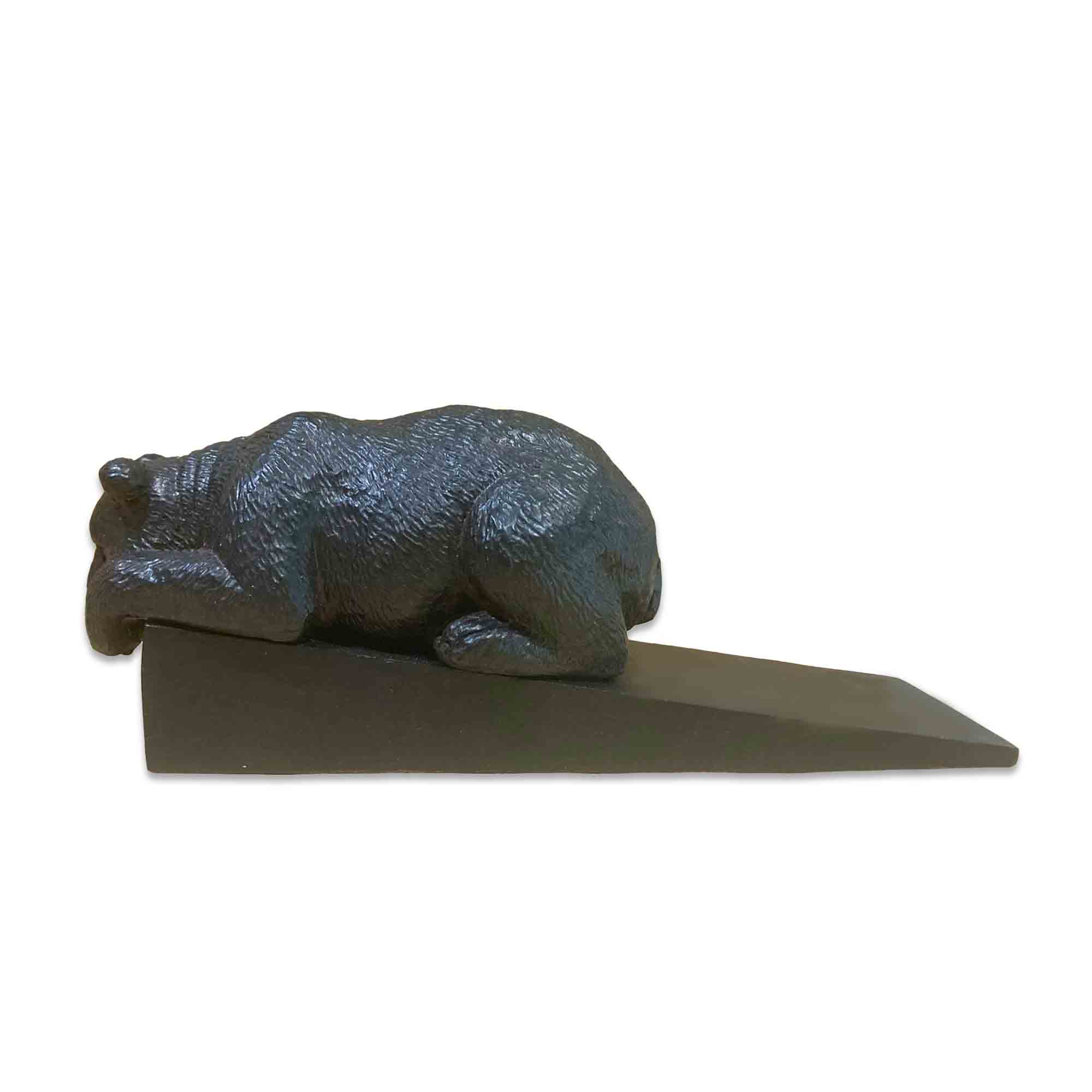 Metal bear-shaped door stopper on a white background