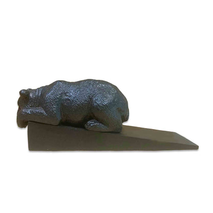 Metal bear-shaped door stopper on a white background