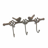 Decorative metal wall hook with bird designs on a white background