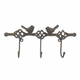 Decorative metal wall hook with bird designs on a white background
