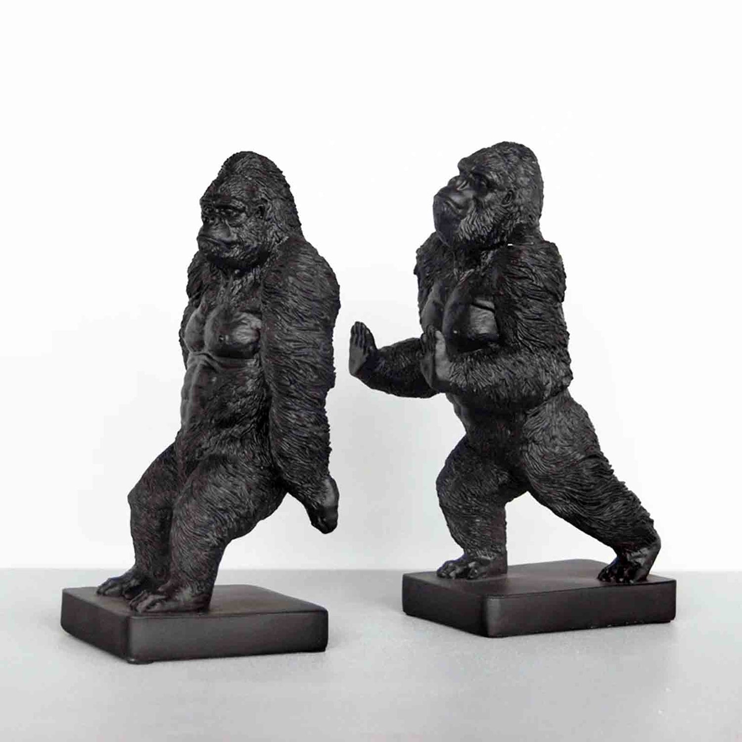 Two gorilla bookends on a white background