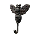 Decorative bee-shaped wall hook on a white background