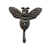 Cast iron bee wall hook on white background