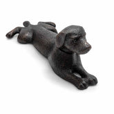 Cast iron dog doorstop on a white background