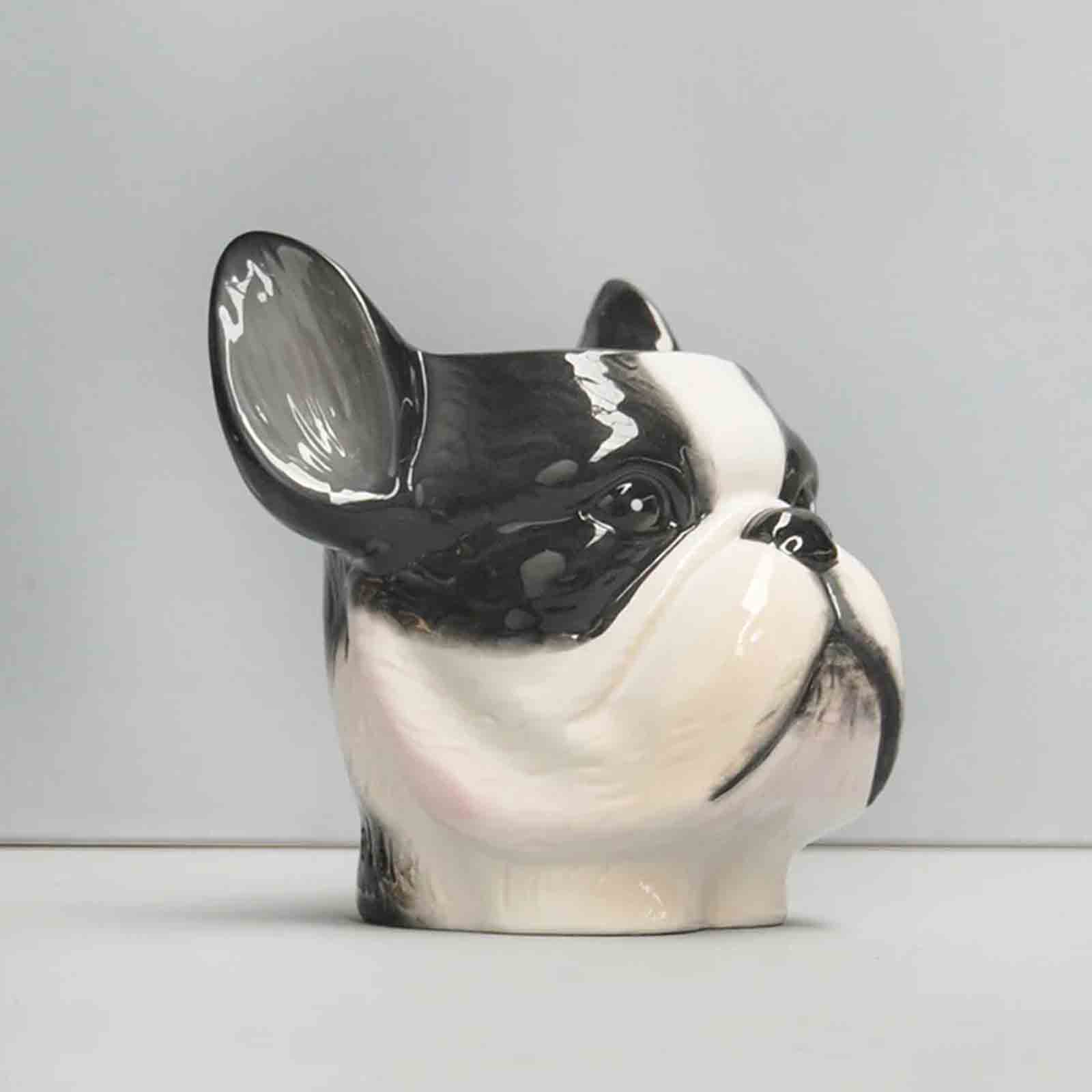 Ceramic French Bulldog-shaped planter / pen holder on a plain background