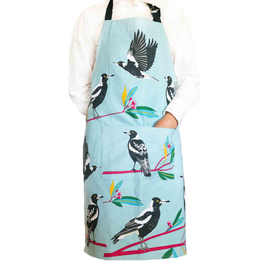 Apron with magpie design on a light mint green background