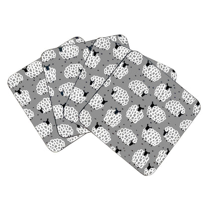 Set of four coasters with a sheep pattern on grey background