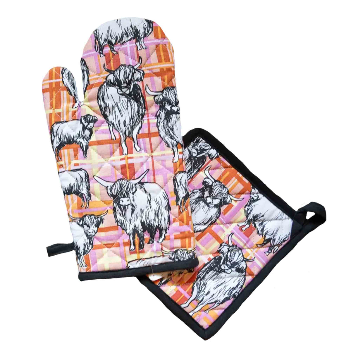 Matching Highland Cows oven glove and pot holder set featuring illustrated Highland cows on a pink, orange and cream tartan background with quilted heat-resistant construction.