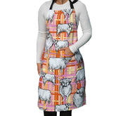 Highland Cows Heavy Drill Cotton Apron featuring a charming Highland cow print on a pink, orange and cream tartan background. Durable cotton kitchen apron with adjustable neck strap, ideal for cooking, baking, gardening, crafting and country-style farmhouse kitchens. Perfect gift for Highland cow lovers, home cooks and bakers.