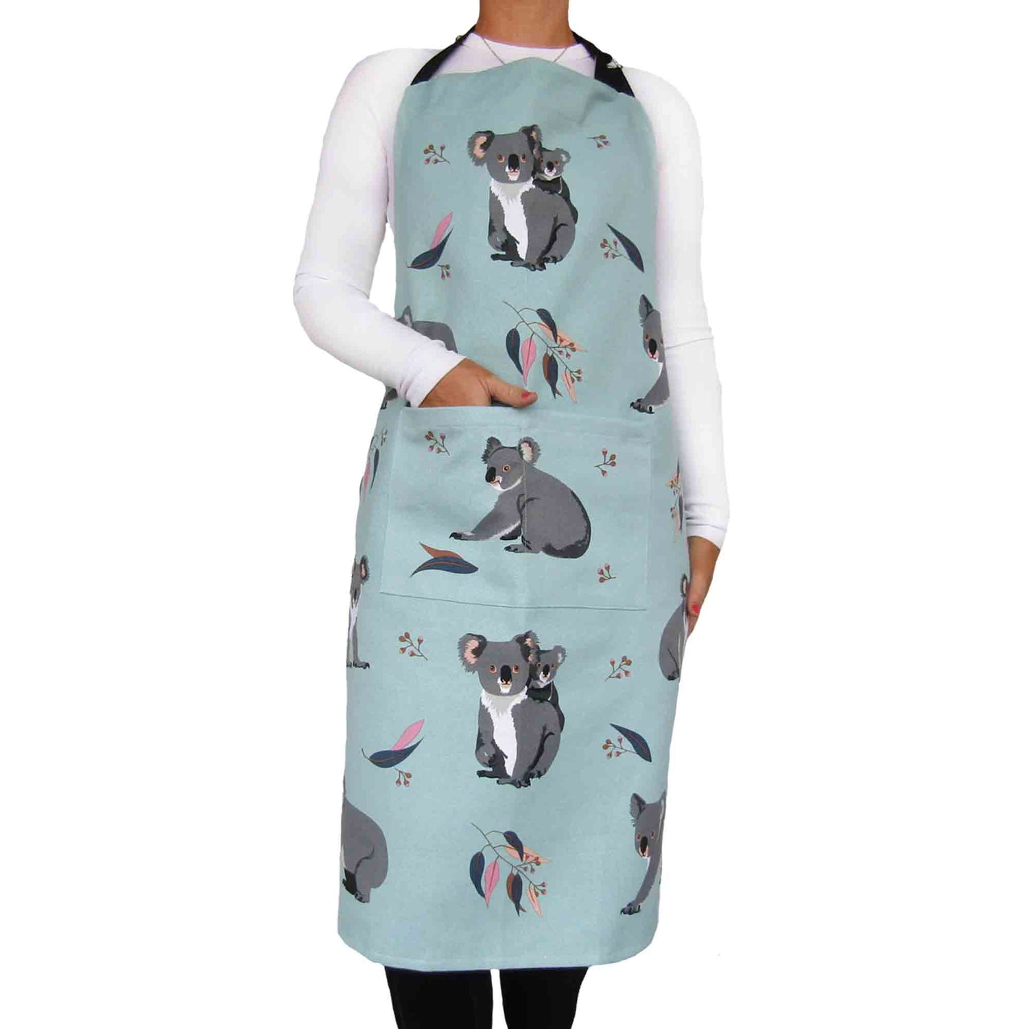 Person wearing a light green apron with koala designs on a white background