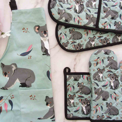 Set of kitchen items with koala pattern on a light green background