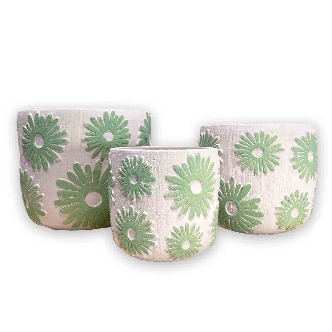 Set of three ceramic planters with green floral patterns on a white background