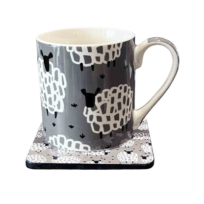 Mug and matching coaster with sheep pattern on a white background