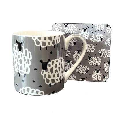 Mug and matching coaster with sheep pattern on a white background