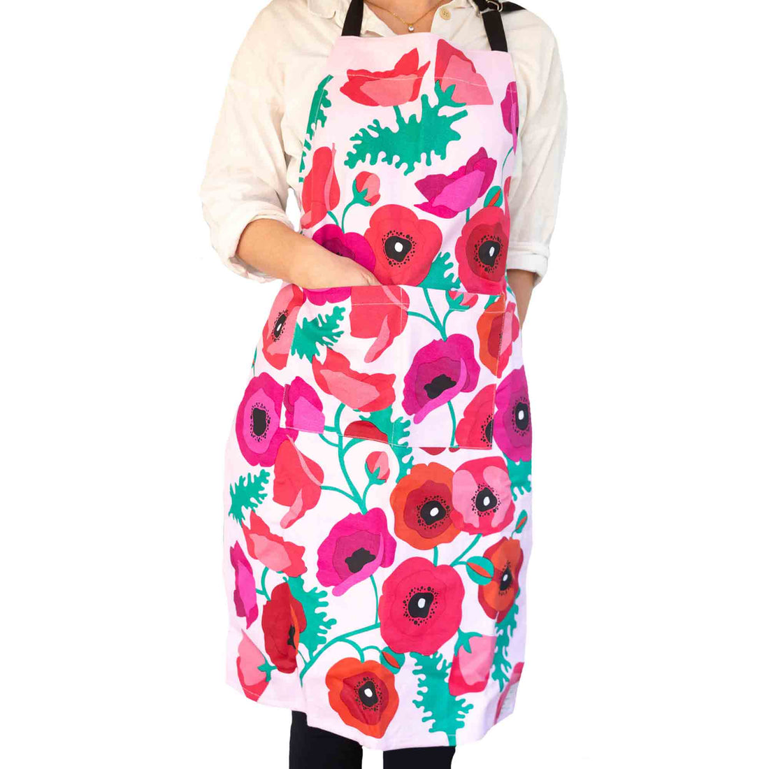Person wearing a colorful floral apron on a white background
