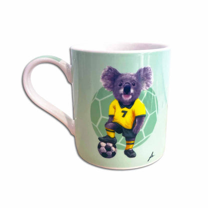 Mug with a koala in a soccer uniform on a light green background