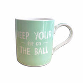 Mint green mug with white text on a white background