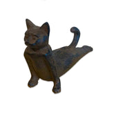 Cast iron cat-shaped door stopper on a white background