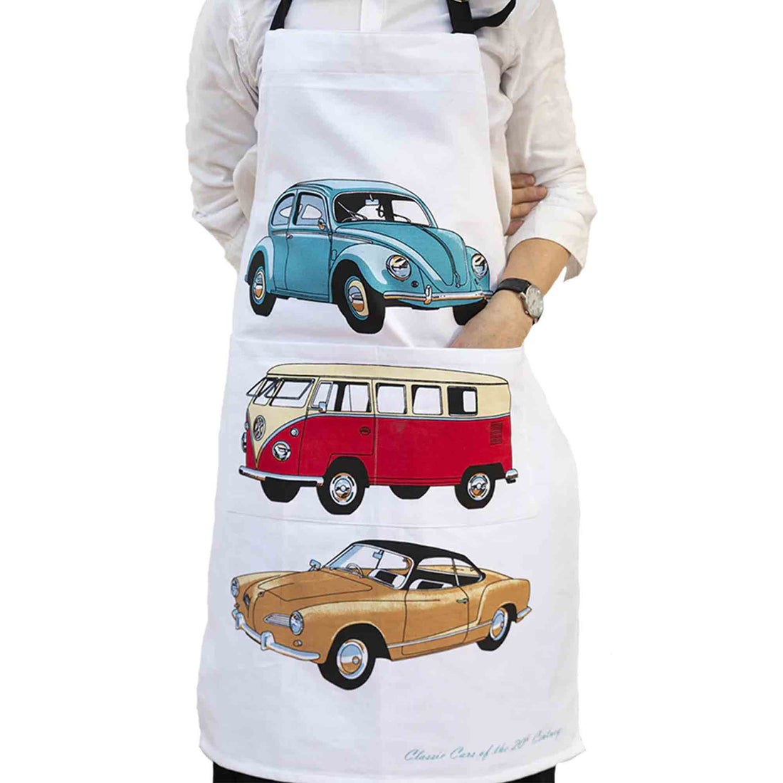 Person wearing a white apron with vintage car illustrations on a white background