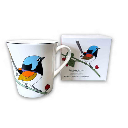 Mug with bird design and packaging on a white background
