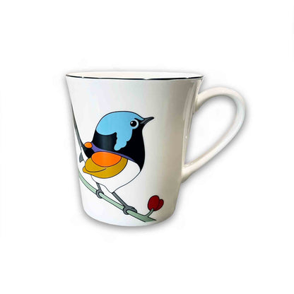 White mug with a colorful bird design on a white background