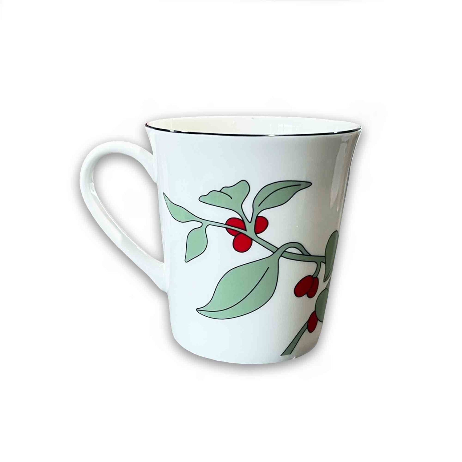 White mug with green leaves and red berries on a white background